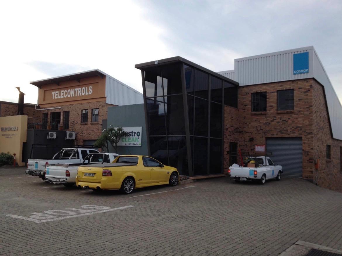 Casnan Civils main office building in Nelspruit with company vehicles parked outside
